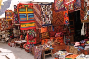 Above and below, a wide array of woven, and other, goods on offer to visiting shoppers in Pisac, Peru’s popular market town.
