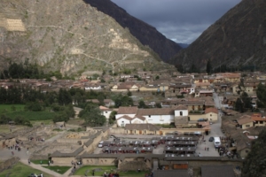 Ollantaytambo, the town, its market (roofs seen at center foreground) and the valley where it sits, as viewed from mountainside terraces. The Ten Niches are barely visible in the upper lefthand corner.