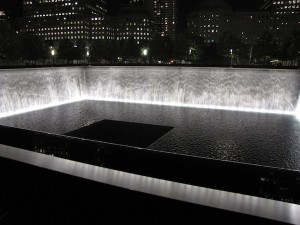 One of two memorial reflecting pools, this one on the footprint of the South Tower, seen at night at the World Trade Center.