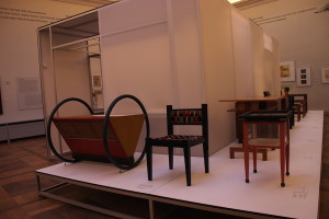 Furniture in the Bauhaus museum, designed by adherents of the Bauhaus movement. The piece at left is a cradle.
