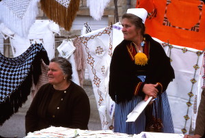 Cilipi woman sell another specialty, embroidered tablecloths.