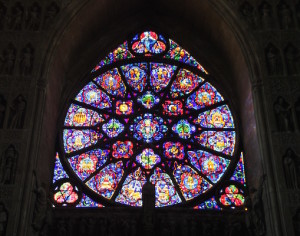 Rose window seen in the Reims Cathedral — but photos don’t do justice to the vivid colors of the cathedral’s windows when they are facing full late-day sun.