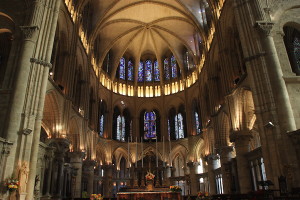 View of the apse and the numerous stained-glass windows in St. Remi Basilica.