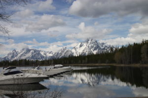 Scene at Colter Bay Village on the shore of Jackson Lake in Grand Teton National Park, with the eponymous mountains providing an over-the-top scenic.