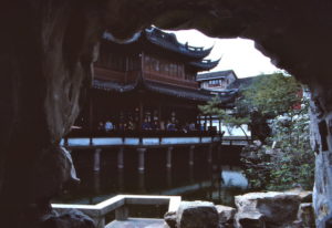 A pavilion inside the Yuyuan Garden, framed by a manmade arched rock formation. The photo dates from 1983.