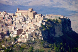 Hill towns we did not visit but could see from other hill towns. It’s easy to surmise why sometimes visitors are well advised to park their cars before reaching the center of a Sicilian hill town. Above is Calascibetta seen from Enna. Below is Castelmola, visible from highest seats in the Greek theater at Taormina.