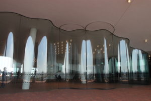 Glass walls that surround portions of the Elbphilharmonie’s Plaza level. Reminiscent of the building’s roofline, these walls also suggest waves due to their undulating formations.
