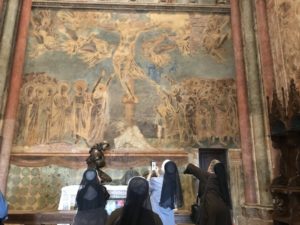 Nuns photographing frescoes in Assisi’s Basilica of St. Francis.