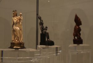 Examples of madonna sculptures from cultures widely separated in time and space, displayed in the Great Vestibule of the Louvre Abu Dhabi.