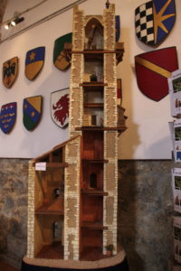 Cutaway view of a model tower house, see at “San Gimignano 1300.”