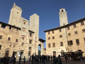 Tower houses seen in Piazza Cisterna, the heart of the medieval San Gimignano. The piazza was named for the well at its center (not visible in this photo).