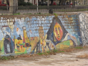 Santiago, Chile (2017): The above was one of an array of colorful images painted on the manmade embankments along the Mapocho River.