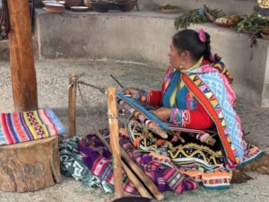 Above, a weaver at the Manos de la Comunidad commune, showing how it is done, for the benefit of tourists. Below, welcoming musicians at the Manos de la Comunidad.