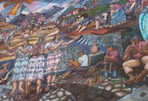 Pisac, Peru (2011): Above, part of an extensive mural in the Andean market town of Pisac, illustrating life in the region. In this section, men and women can be seen harvesting potatoes (upper right); working the land (upper left), and making pottery (lower right).