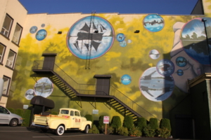 Aberdeen, Washington (2018): This mural takes away any drabness from a parking lot. A small town, Aberdeen is known for street art, which includes, besides murals, a series of fabricated “rare and endangered species,” sculpted by some very imaginative artists.