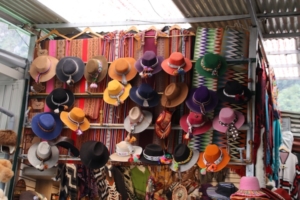 Above, a small section of the sizeable artisans market next to the train station in Machu Picchu Pueblo. This merchant emphasized woven goods and hats. Below, the main square in Machu Picchu Pueblo.