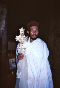 Priest at the small Beta Meskal (House of the Cross) rock-hewn church in Lalibela, Ethiopia.
