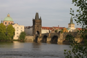 Above, Prague’s 14th century Charles Bridge, which connects Old Town with Lesser Town just below Castle Hill. The bridge is the setting for an early dramatic event in Dan Brown’s book, “The Secret of Secrets.” Below, walkers on the pedestrian-only Charles Bridge.