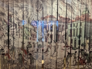 A copy of a late 1770s engraving designed to illustrate the look of New York City during the September 1776 Great Fire. In this case, the engraver’s image was transferred to strips of fabric that function as a flexi-door to the next room in “The Occupied City” exhibit at the Museum of the City of New York.