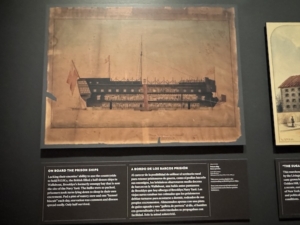 An artist’s illustration of a POW ship of the type that would have been seen in New York Harbor when the city was occupied during the American Revolution. The artist shows prisoners tightly packed on two deck levels.