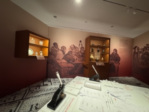 A separate room in “The Occupied City” exhibit set aside for tantalizing reflection. We, as visitors, are invited to fill out a questionnaire. Results purport to determine if we might have been revolutionaries or loyalists.
