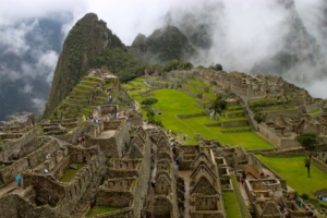 Above, sweeping view of the Machu Picchu archaeological site. Below, llamas hanging out on the terraces at Machu Picchu. (2011 photos)