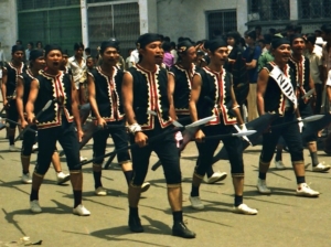 Men of Nias Island at Indonesia’s Independence Day parade, in Medan, capital of the North Sumatra province on Sumatra. Some carry spears; Nias men are known for their war dances.