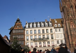 Strasbourg’s cathedral (a sliver appears at right) and Maison Kammerzell, upper left, overlook the holiday shopping in Cathedral Square. Strasbourg’s tourist office is in the building to the right of Maison Kammerzell.
