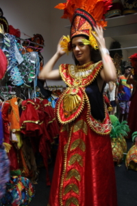 Manoela Barcellos, public relations manager in Brazil for the Marriott group, tries on a typical carnival costume during a visit to Samba City.
