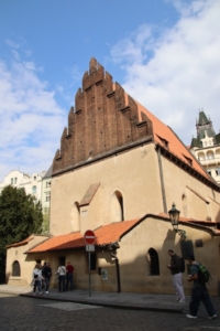 Above, exterior of the small, very old (from the 13th century) and still-active Old New Synagogue in Prague’s historical Jewish Quarter. Below, the exterior metal footholds that provide the only access to the synagogue’s attic. Their relevance came up while sightseeing at locations related to “The Secret of Secrets.”