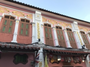 Renovated Sino-Portuguese shophouses, with their distinct decorative features, seen on the Rommani side street. Below, a panoramic view of the same street’s restored houses.