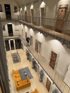 Atrium in La Prison Hotel, the same atrium that once served a prison cellblock.