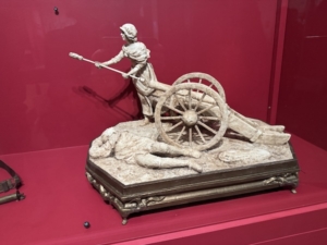 Small new (2025) sculpture of Margaret Corbin, envisioning her as she takes over a cannon to compensate for the deaths of numerous men during the Battle of Fort Washington in November 1776 in New York’s Upper Manhattan.