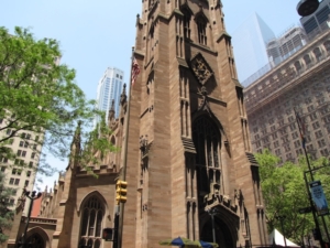 Trinity Church, on Broadway facing Wall Street, as it looks today. This is the third iteration of Trinity. The post-fire reconstruction was replaced in the mid-19th century after its roof gave way. The result is one of America’s finest examples of Neo-Gothic architecture.