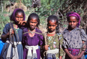 Above and below, oung women who agreed to be photographed at one of several impromptu roadside stops during a drive across Ethiopia. As I took photos, the group got larger.
